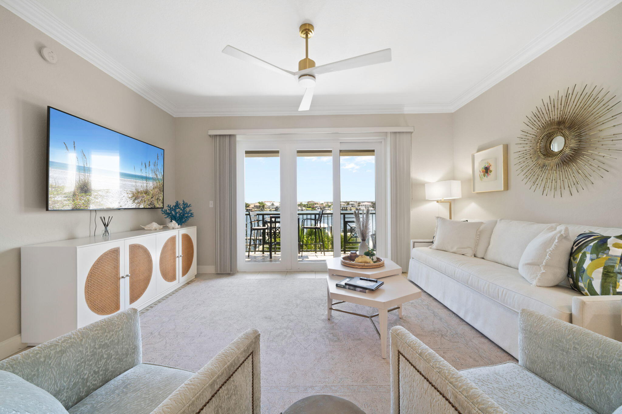 602 Harbor Boulevard, Unit 103 Destin, FL 32541 - Photo 22 of 47 a living room with furniture and a flat screen tv