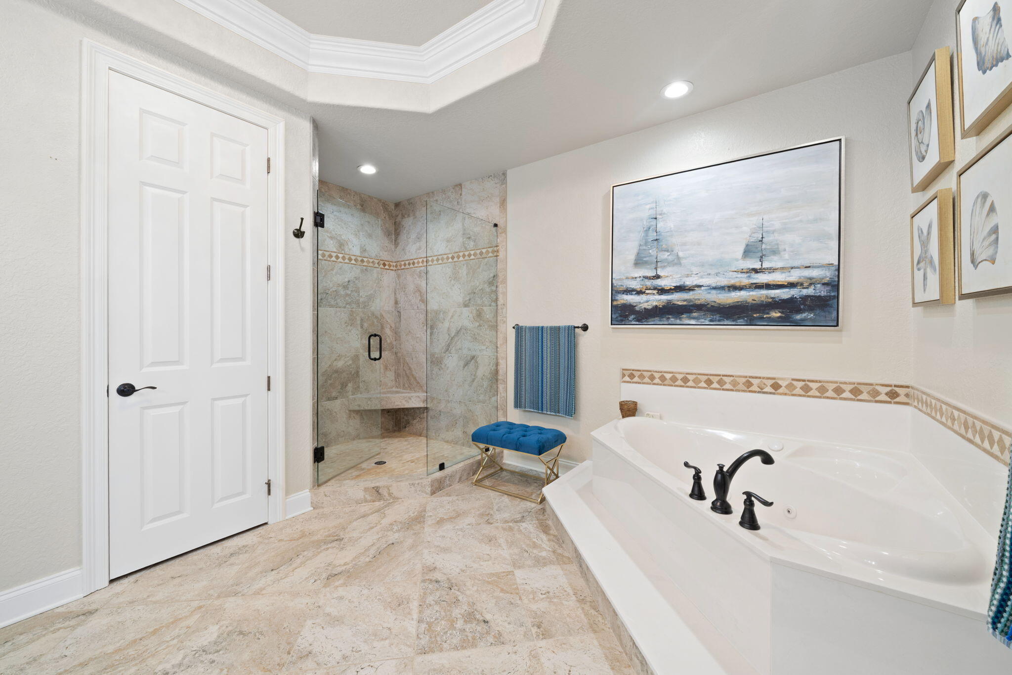 602 Harbor Boulevard, Unit 103 Destin, FL 32541 - Photo 29 of 47 a bathroom with a tub sink and mirror