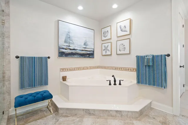 a bathroom with a bathtub and shower
