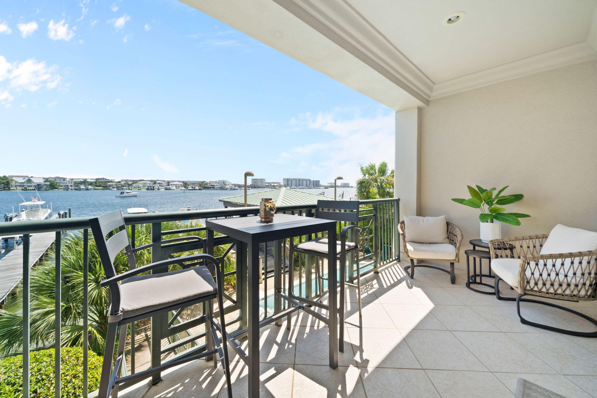 602 Harbor Boulevard, Unit 103 Destin, FL 32541 - Photo 3 of 47 a view of a chairs and table in patio