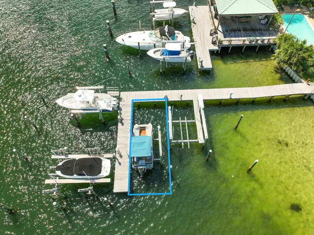 a view of an ocean house swimming pool and outdoor seating
