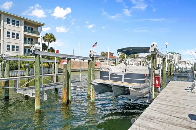 a roof deck with table and chairs