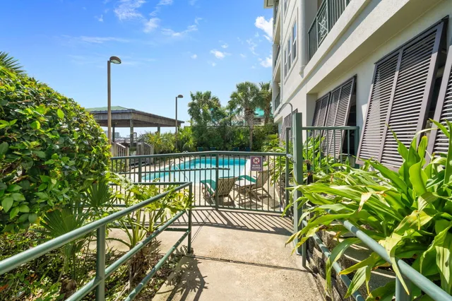 a view of a balcony with a potted plant