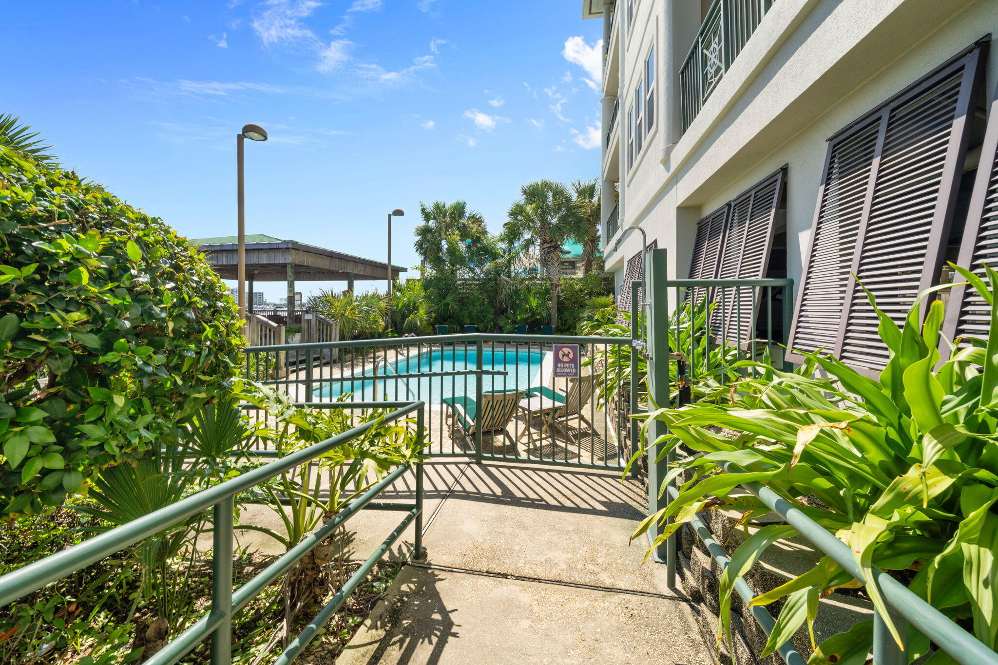 602 Harbor Boulevard, Unit 103 Destin, FL 32541 - Photo 39 of 47 a view of a balcony with a potted plant