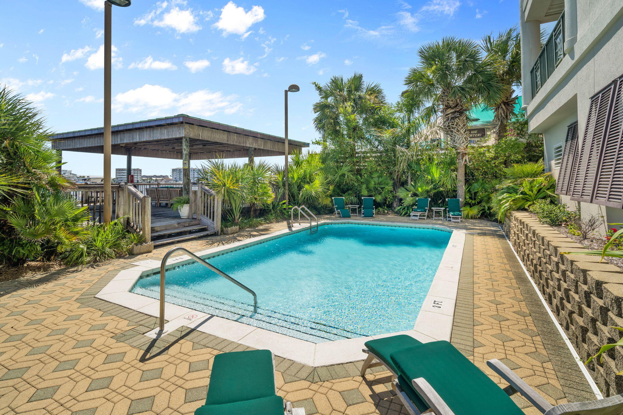 602 Harbor Boulevard, Unit 103 Destin, FL 32541 - Photo 41 of 47 a view of a chairs and table in the patio