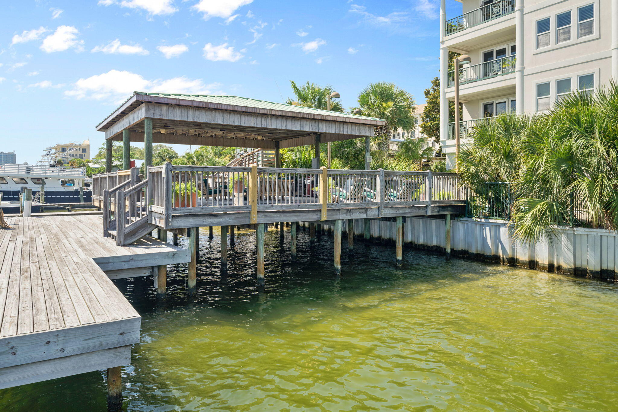602 Harbor Boulevard, Unit 103 Destin, FL 32541 - Photo 42 of 47 a view of a house with pool and chairs