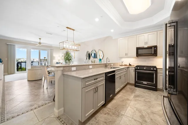 a kitchen with a sink stove and refrigerator