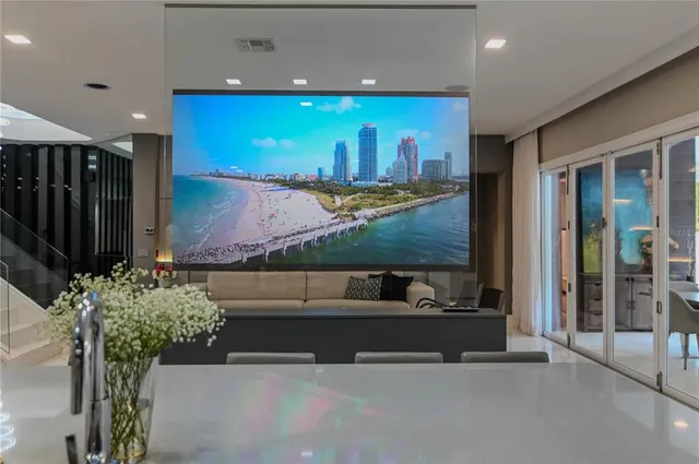 a dining room with a wooden table and chairs