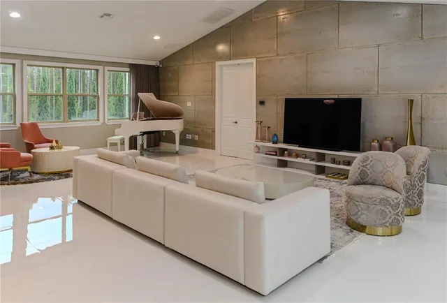 a kitchen with stainless steel appliances a microwave a sink and a refrigerator