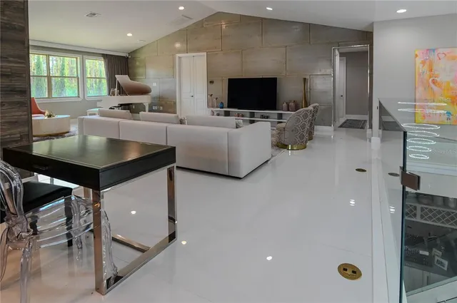 a view of a bedroom with furniture and a chandelier