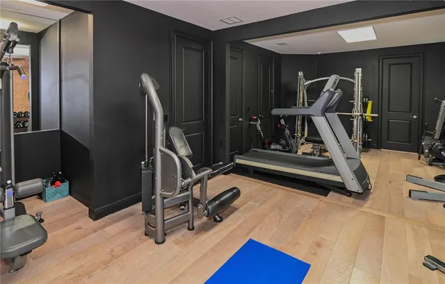 a bathroom with a tub shower and sink