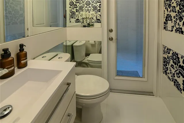 a view of a livingroom with furniture and a window