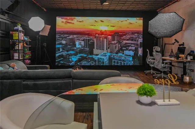 a view of a kitchen with kitchen island and white cabinets