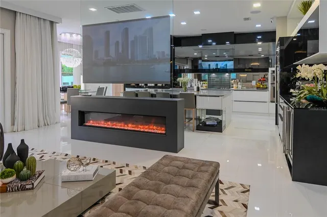 a kitchen with stainless steel appliances kitchen island granite countertop a refrigerator and a stove top oven