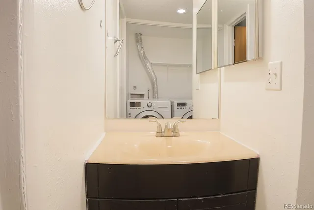 a bathroom with a sink and a mirror