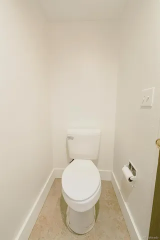 a white toilet sitting next to a white sink