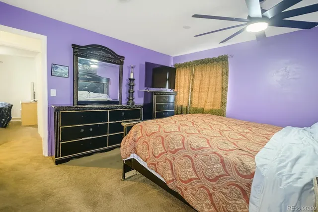 a bedroom with a bed and a dresser