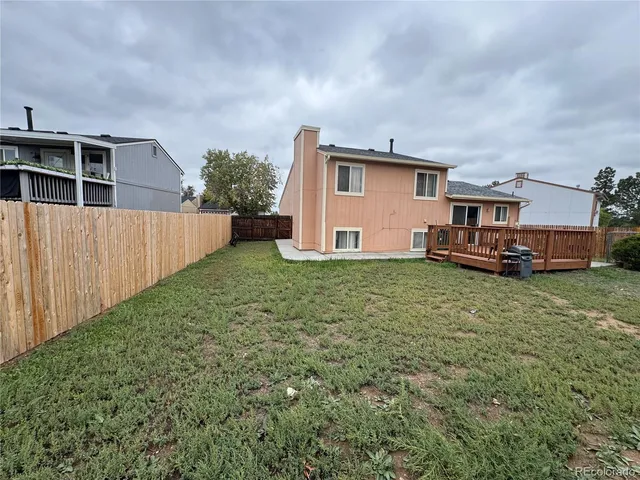 a view of a house with a back yard