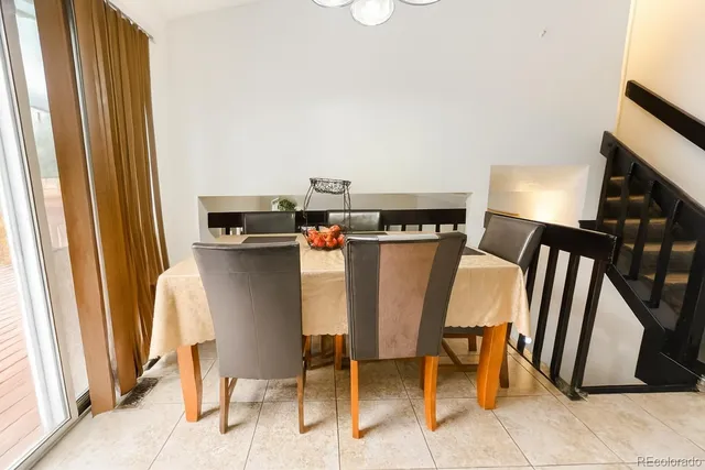 a view of a dining room with furniture and a window