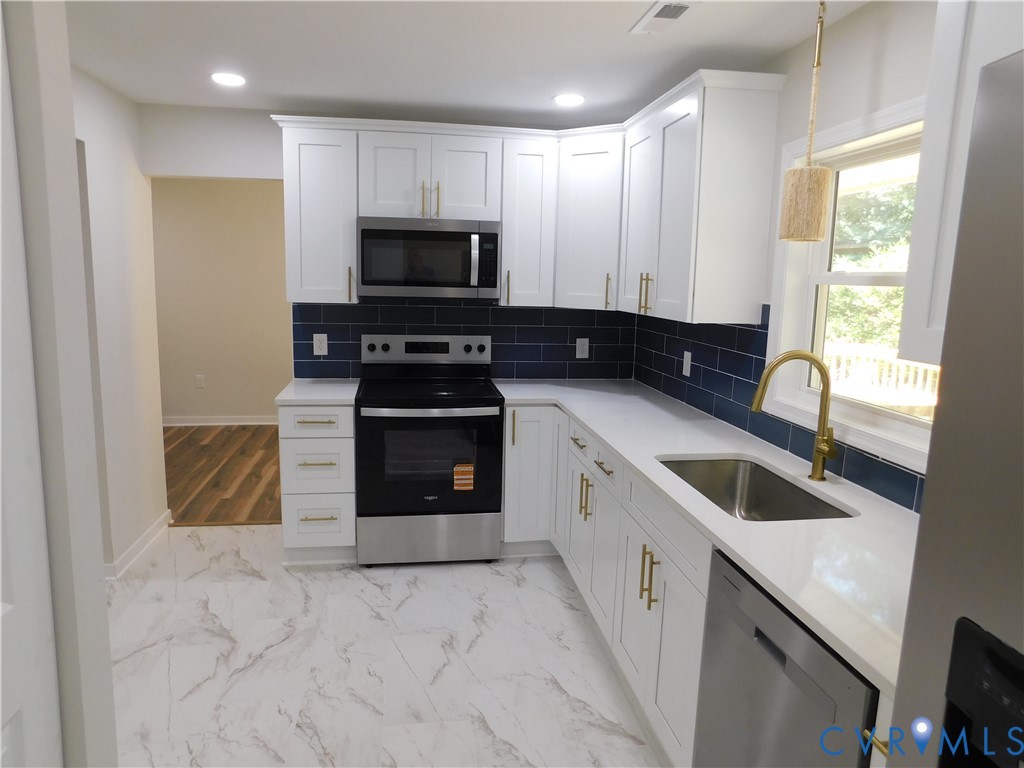 5322 Adams Road Quinton, VA 23141 - Photo 35 of 56 Kitchen featuring white shaker-style cabinetry, st