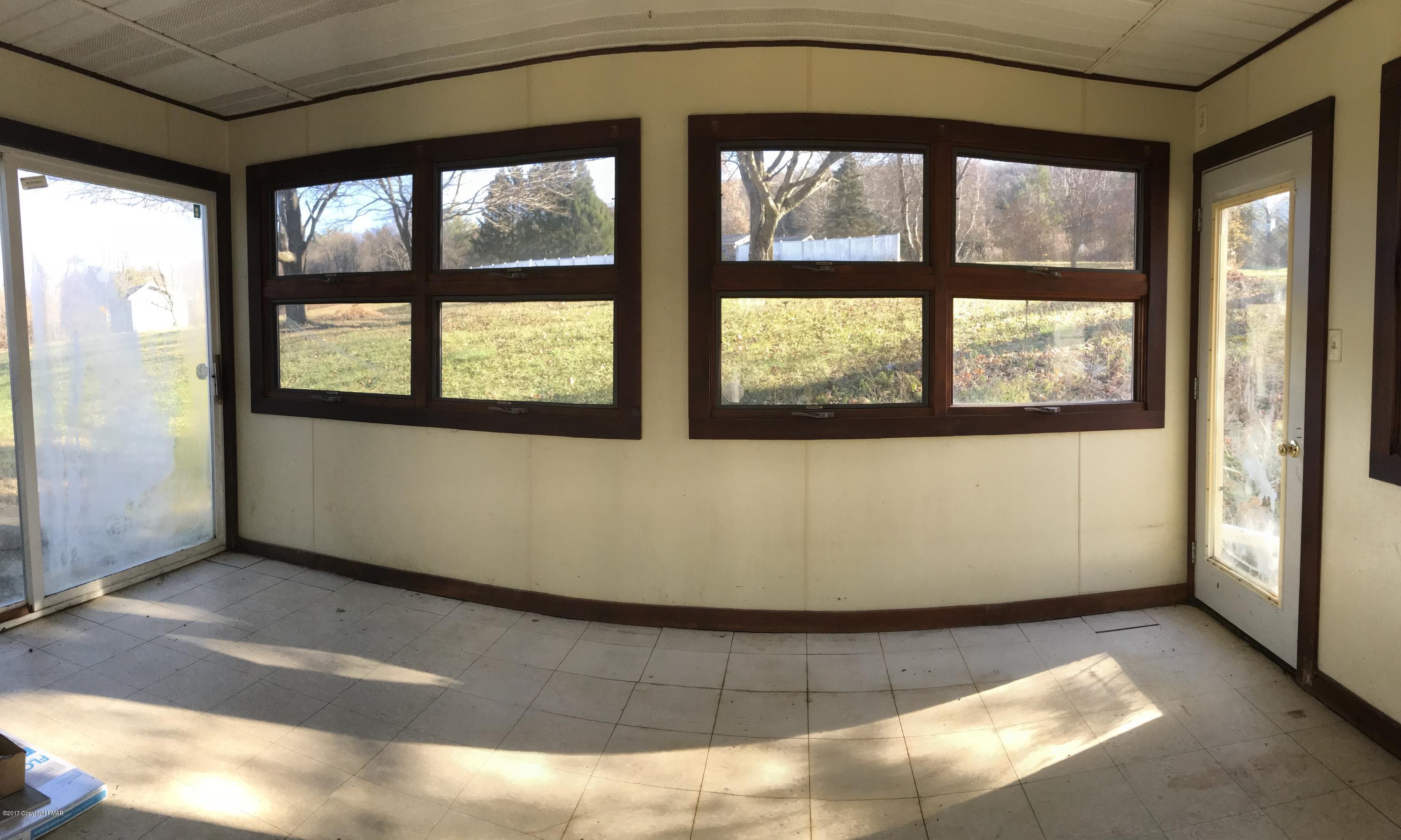126 Old Stagecoach Road Gilbert, PA 18331 - Photo 9 of 24 3 Season Room facing Back yard