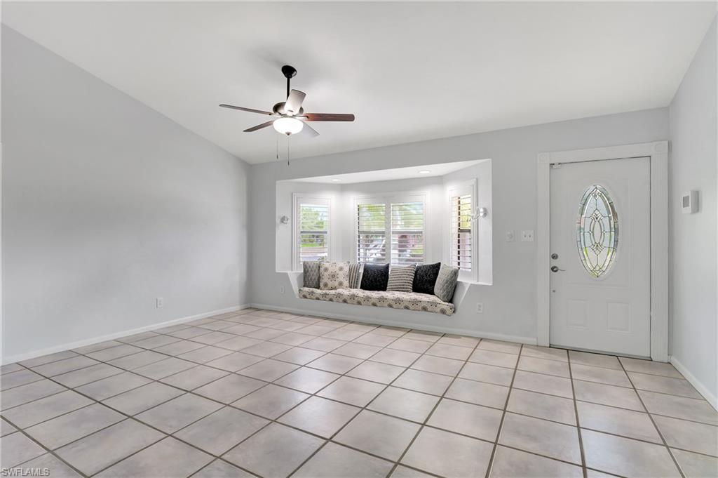 3035 42nd Terrace Southwest Naples, FL 34116 - Photo 12 of 48 patterned floors, and vaulted ceiling