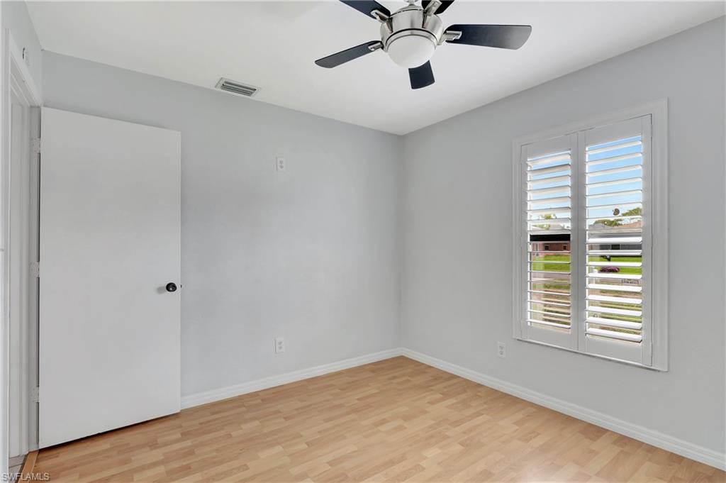 3035 42nd Terrace Southwest Naples, FL 34116 - Photo 25 of 48 Guest room featuring light wood-type flooring and a ceiling fan.
