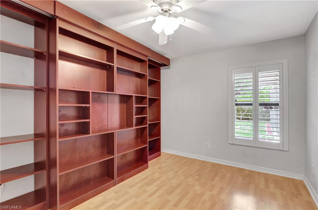 3035 42nd Terrace Southwest Naples, FL 34116 - Photo 27 of 48 Unfurnished bedroom featuring light wood-style floors and ceiling fan.