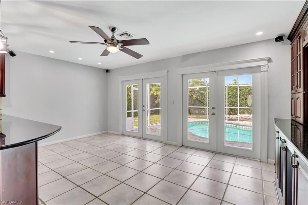 3035 42nd Terrace Southwest Naples, FL 34116 - Photo 31 of 48 Unfurnished dining area with french doors, ceiling fan, recessed lighting, and light tile patterned flooring