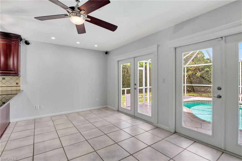 3035 42nd Terrace Southwest Naples, FL 34116 - Photo 32 of 48 Entryway with french doors, ceiling fan, recessed lighting, and tile patterned flooring