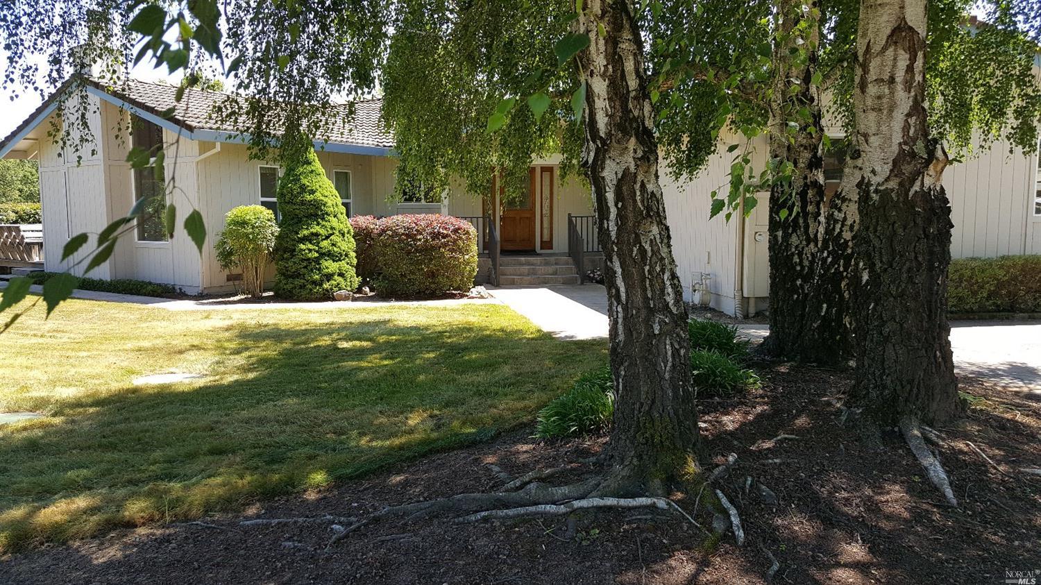 3448 Henry Lane Santa Rosa, CA 95401 - Photo 1 of 1 a view of a yard in front of a house with a tree