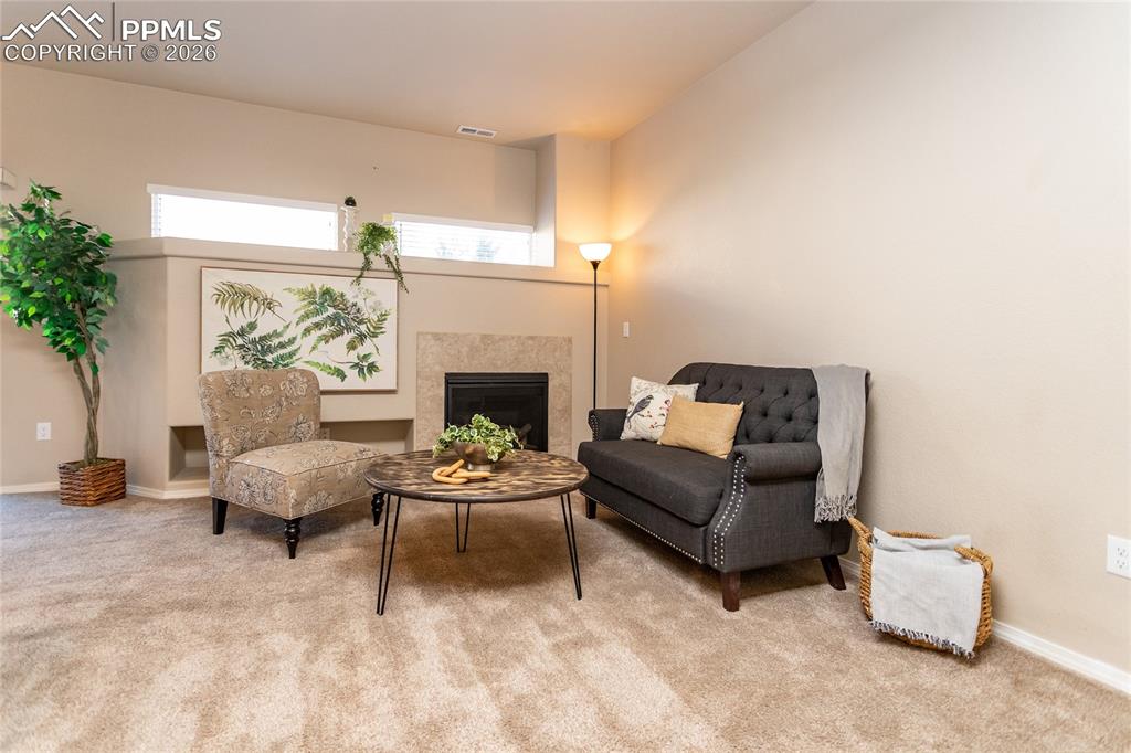 1534 York Road Colorado Springs, CO 80920 - Photo 14 of 38 a living room with furniture and a fireplace