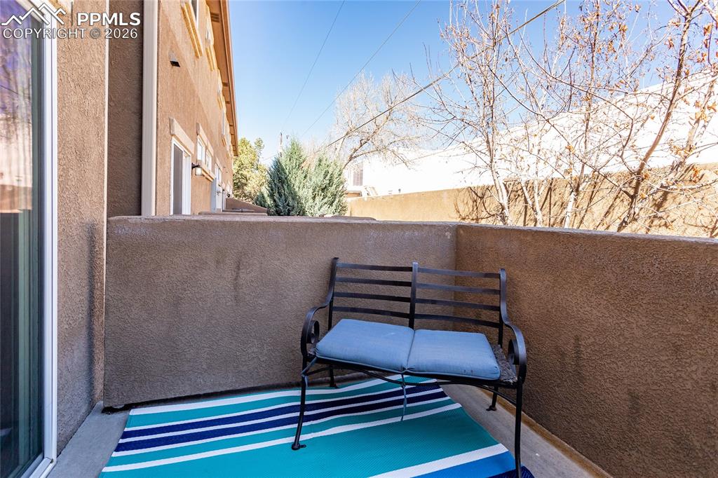 1534 York Road Colorado Springs, CO 80920 - Photo 19 of 38 a wooden bench sitting in front of a building