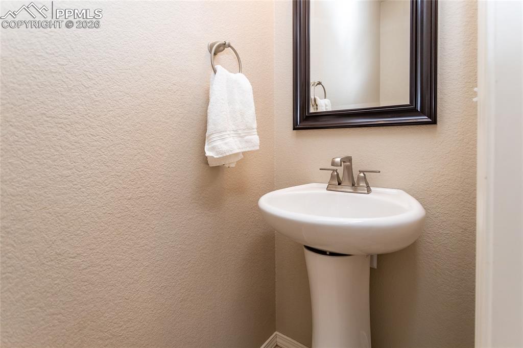 1534 York Road Colorado Springs, CO 80920 - Photo 20 of 38 a bathroom with a sink and a mirror