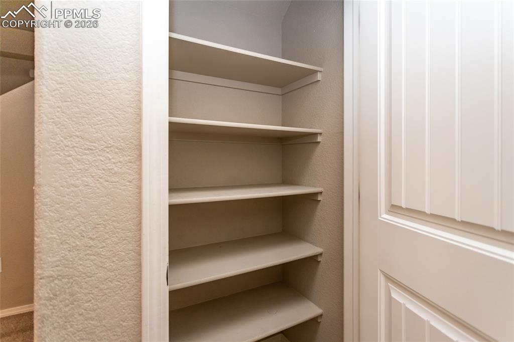 1534 York Road Colorado Springs, CO 80920 - Photo 21 of 38 a storage room with wooden floor