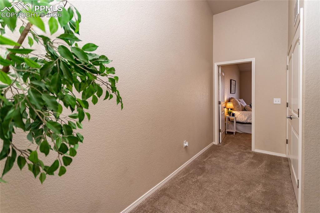 1534 York Road Colorado Springs, CO 80920 - Photo 23 of 38 a view of a hallway with wooden floor