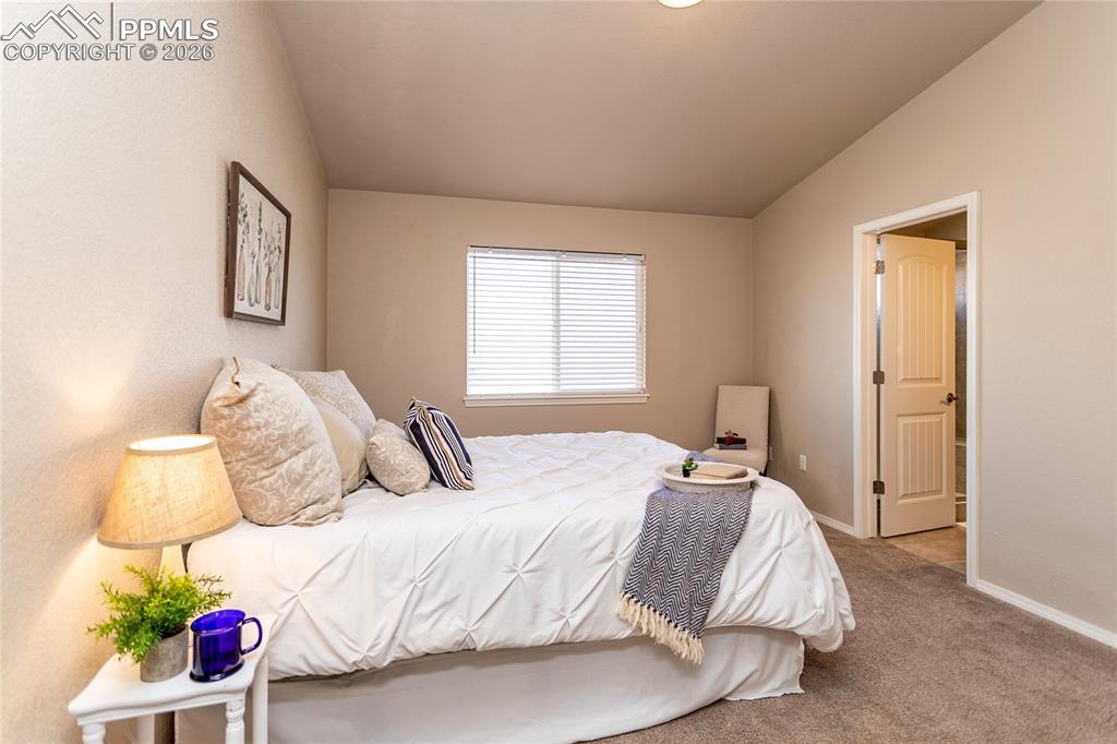 1534 York Road Colorado Springs, CO 80920 - Photo 24 of 38 a bedroom with a bed and a window