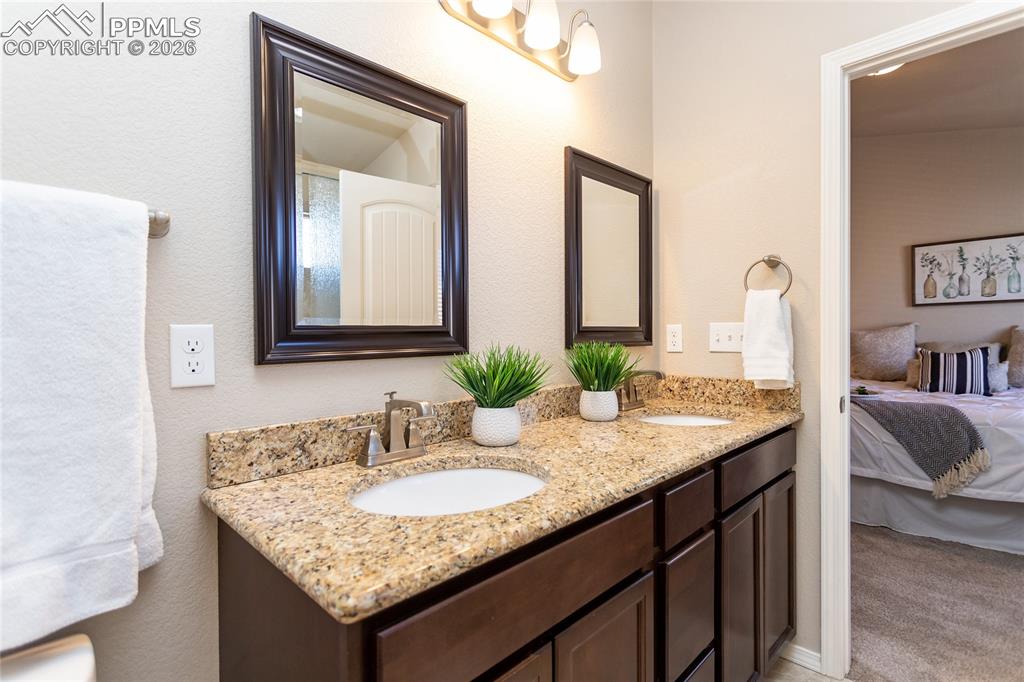 1534 York Road Colorado Springs, CO 80920 - Photo 29 of 38 a bathroom with sinks granite and a sink