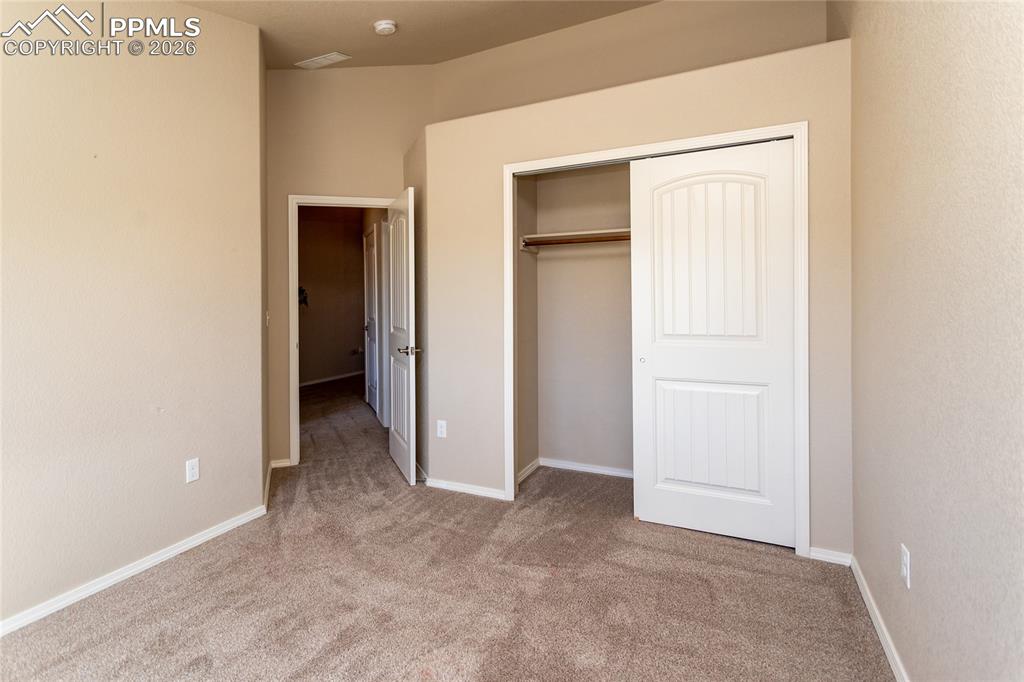 1534 York Road Colorado Springs, CO 80920 - Photo 37 of 38 an empty room with closet and a bathroom