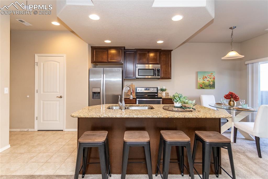 1534 York Road Colorado Springs, CO 80920 - Photo 6 of 38 a view of a dining room with furniture