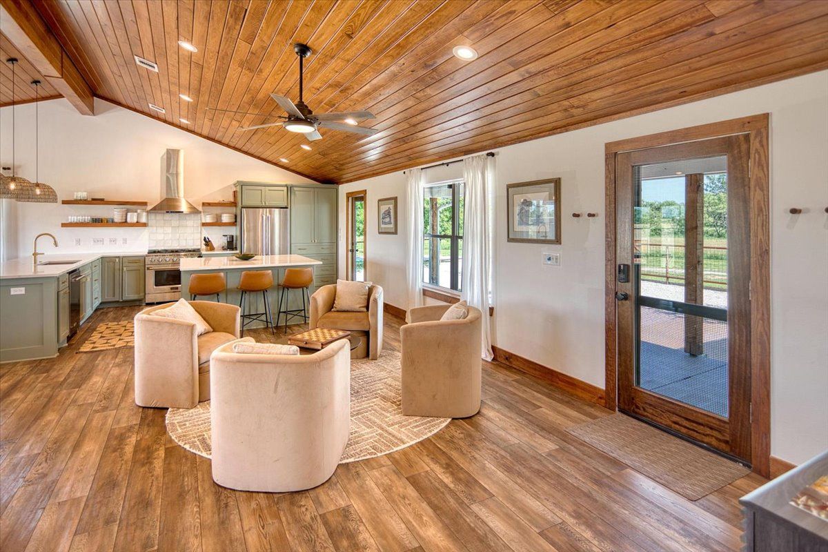 19811 West Ranch Road 152 Llano, TX 78643 - Photo 23 of 38 a living room with furniture a large window with kitchen view