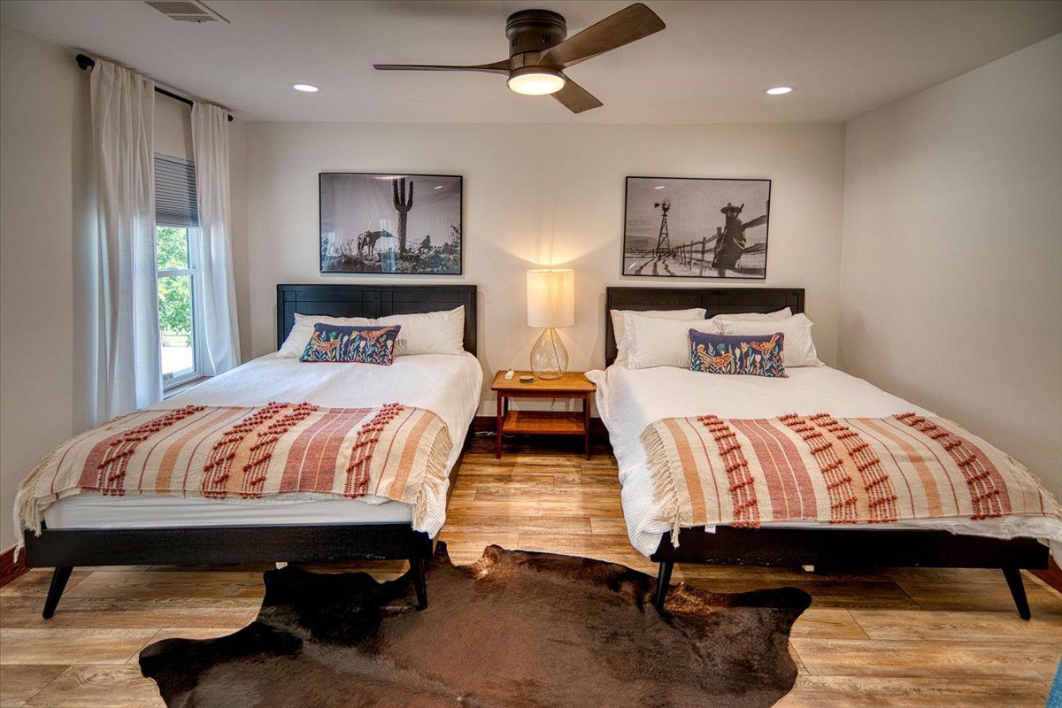 19811 West Ranch Road 152 Llano, TX 78643 - Photo 29 of 38 a bedroom with double bed and a night stand