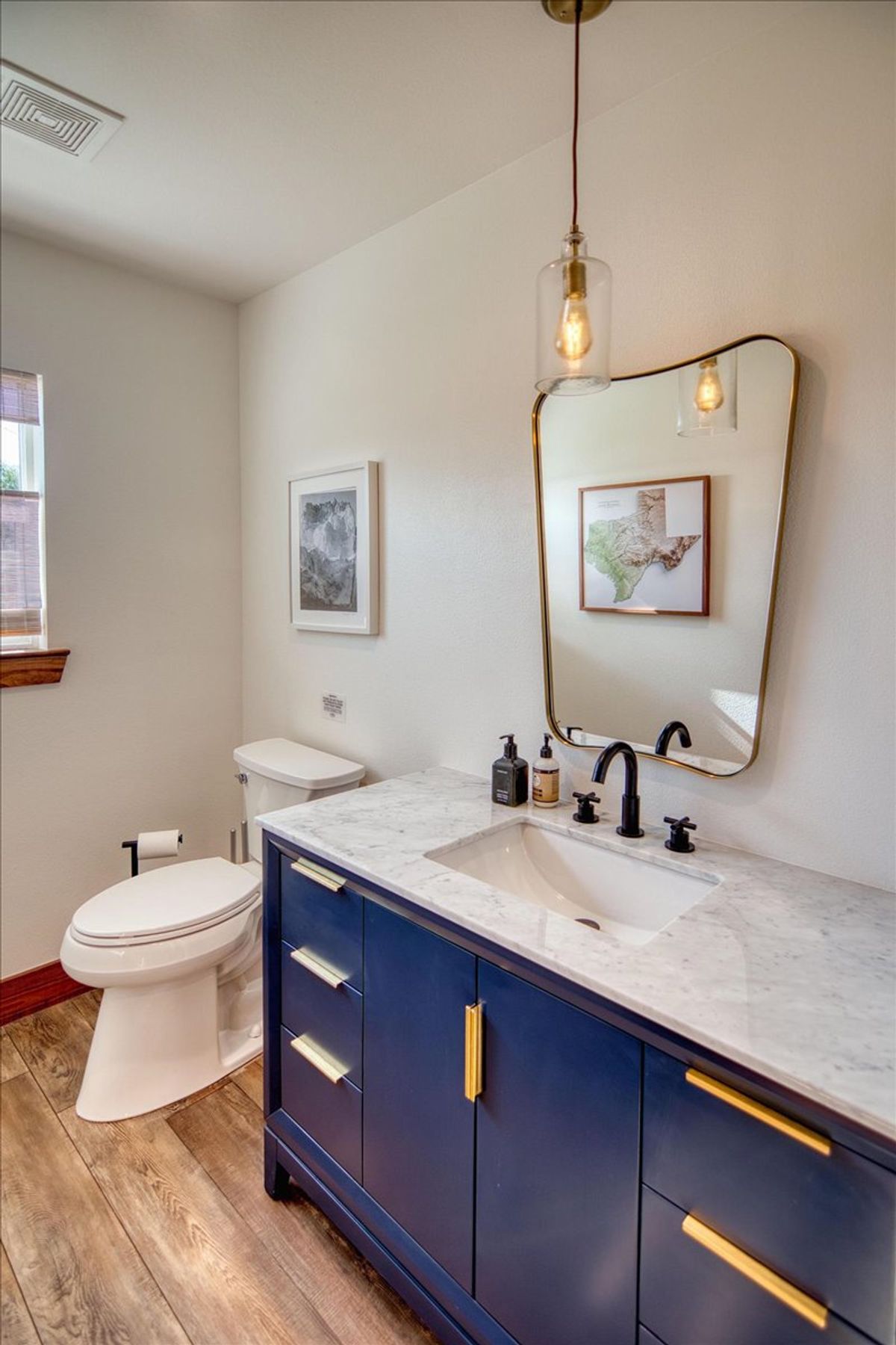 19811 West Ranch Road 152 Llano, TX 78643 - Photo 34 of 38 a bathroom with a toilet sink and mirror