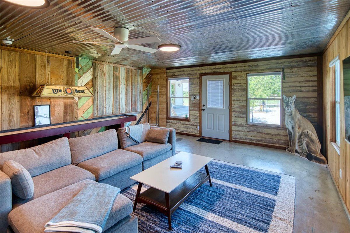 19811 West Ranch Road 152 Llano, TX 78643 - Photo 36 of 38 a living room with furniture and a fireplace