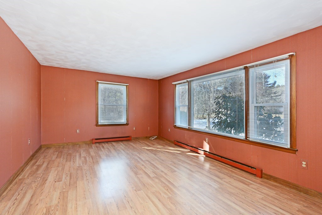 2240-2242 Barre Road Hardwick, MA 01031 - Photo 11 of 31 an empty room with wooden floor and windows