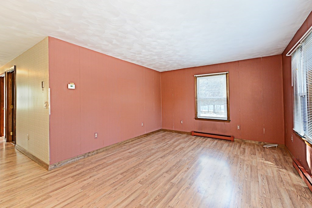 2240-2242 Barre Road Hardwick, MA 01031 - Photo 12 of 31 an empty room with wooden floor and windows