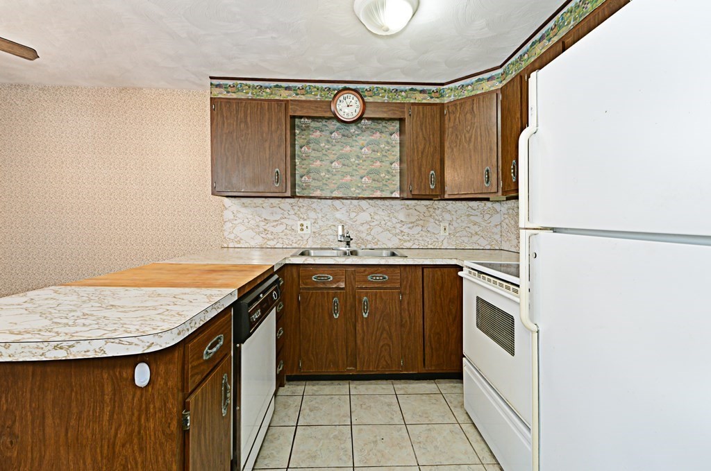 2240-2242 Barre Road Hardwick, MA 01031 - Photo 16 of 31 a bathroom with a granite countertop sink and washing machine