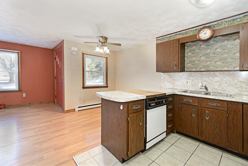 2240-2242 Barre Road Hardwick, MA 01031 - Photo 17 of 31 a kitchen with stainless steel appliances granite countertop a sink and a stove top oven