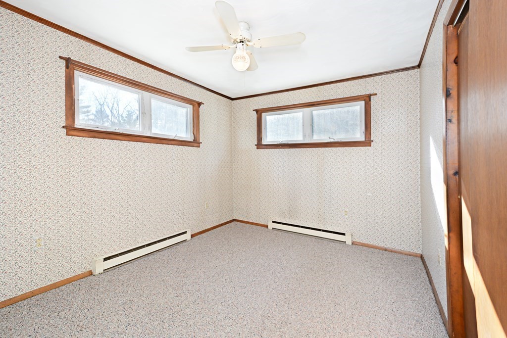 2240-2242 Barre Road Hardwick, MA 01031 - Photo 21 of 31 an empty room with windows and fan
