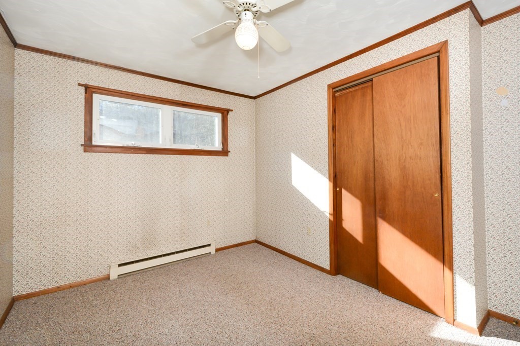 2240-2242 Barre Road Hardwick, MA 01031 - Photo 22 of 31 an empty room with windows and fan